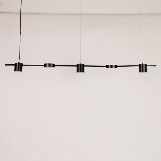 Black linear pendant light displayed unlit on white background with multiple adjustable heads for modern dining or kitchen lighting.