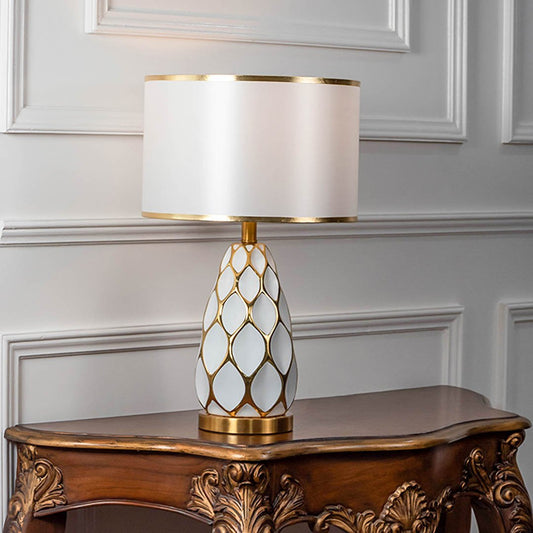 Modern table lamp with textured white base and white shade on wooden console table elegant lighting for classic home decor.