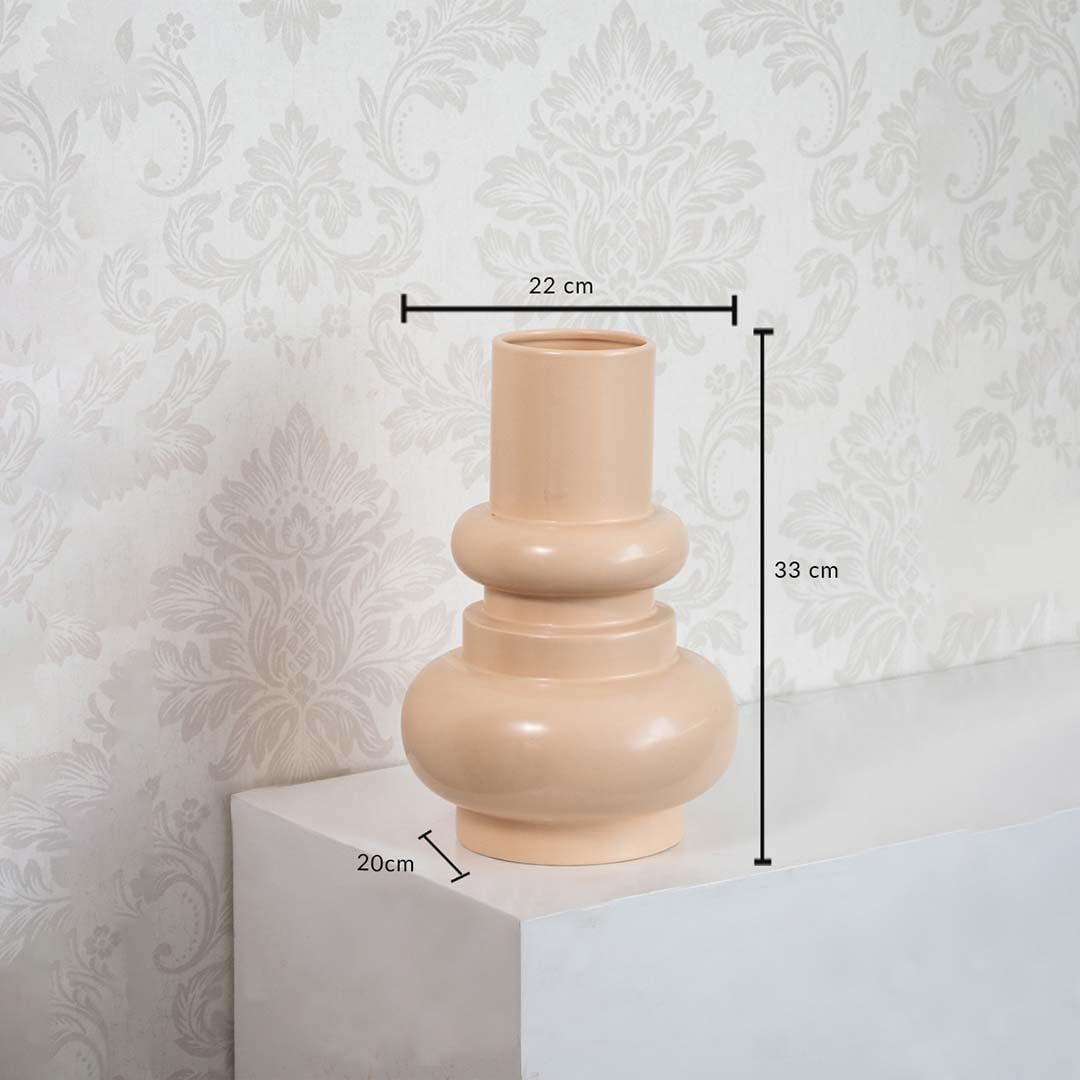 Peach sculptural vase dimension display showing height 33 cm width 22 cm and base depth 20 cm against a minimal white background.
