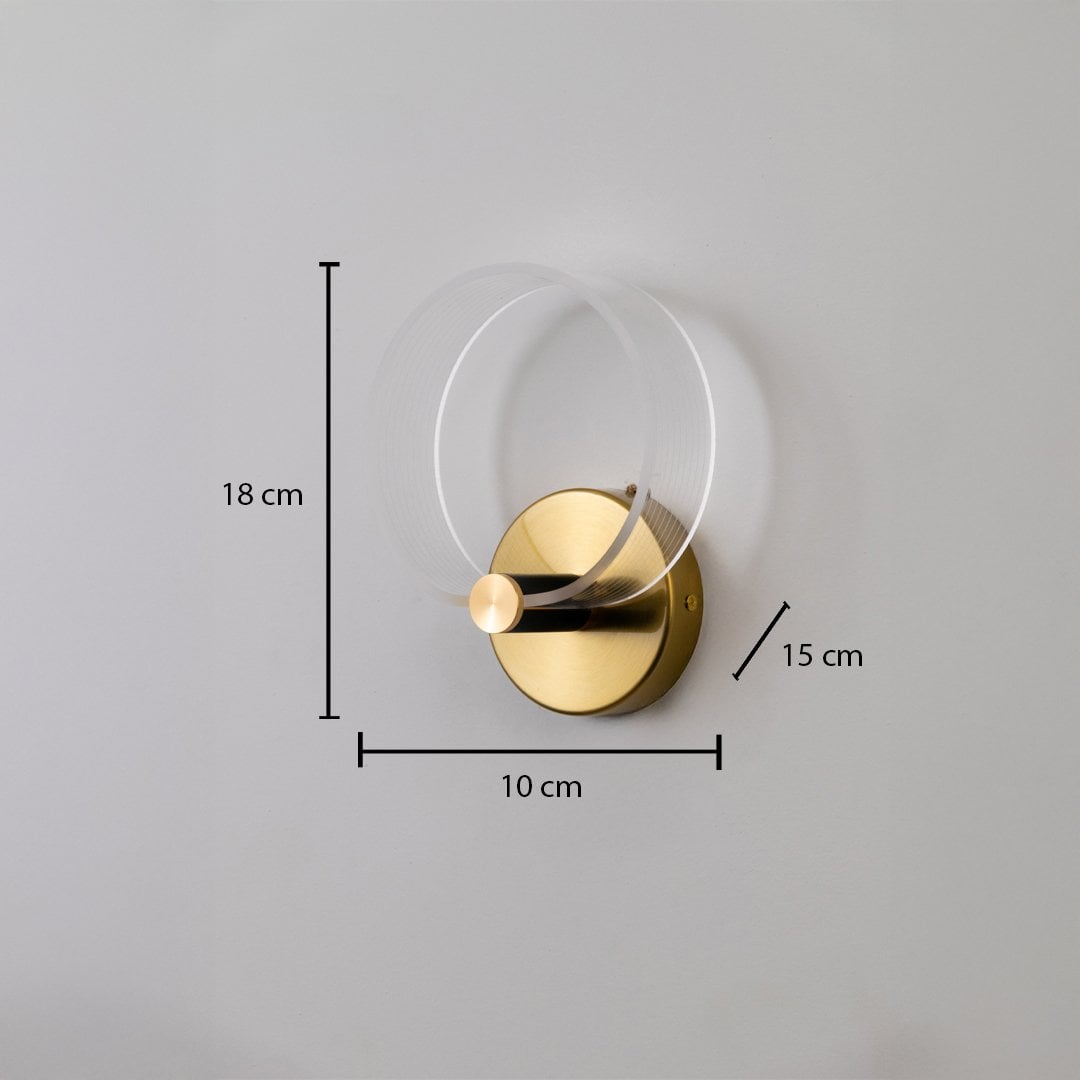 Gold wall light with frosted acrylic ring shown with 18 cm height 10 cm width and 15 cm depth for accurate placement.