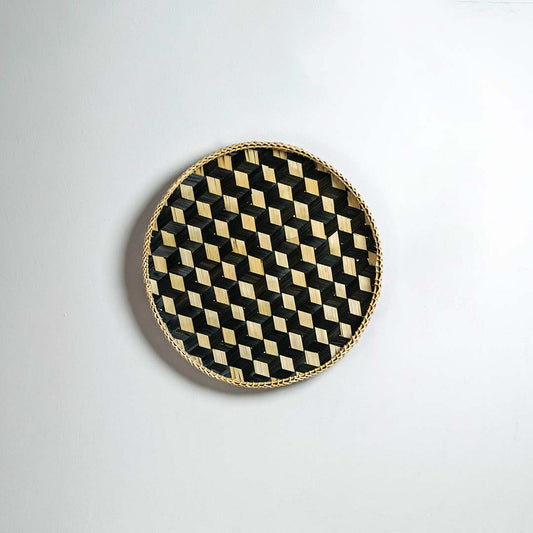 Black decorative wall plate with gold geometric pattern for contemporary wall styling and luxury home decor.