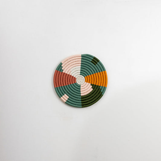 Multicolor decorative wall plate with geometric patchwork pattern for elegant wall styling and modern home decor.