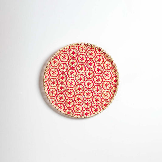 Red decorative wall plate with geometric floral pattern for artistic wall styling and contemporary home decor.