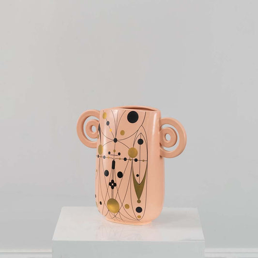 Peach abstract ceramic vase with decorative loop handles shown on a clean white background ideal for modern stylish decor.