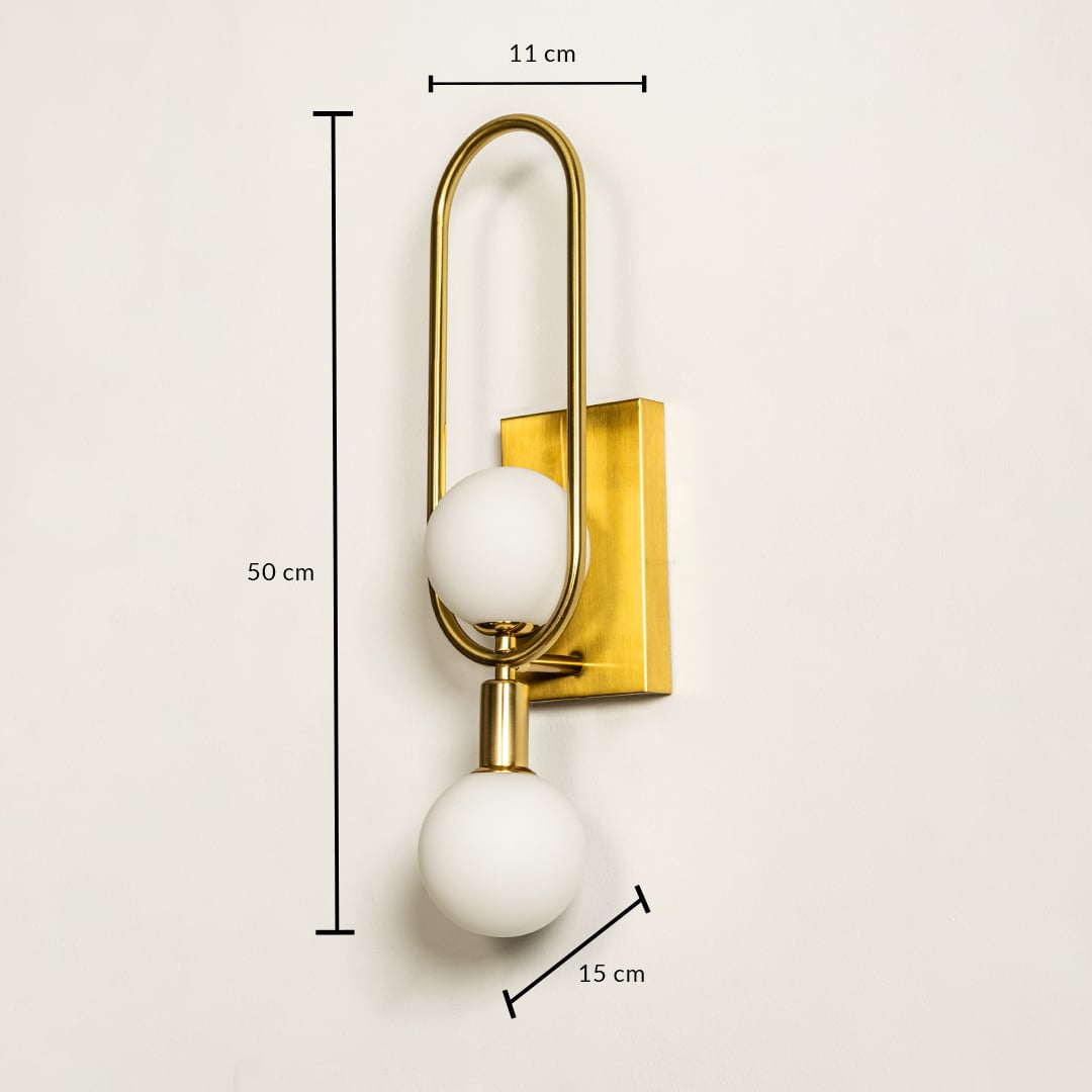 Luxury gold double globe wall sconce with sleek frame shown with height 52 cm width 13 cm and depth 17 cm perfect for premium décor and modern interiors.