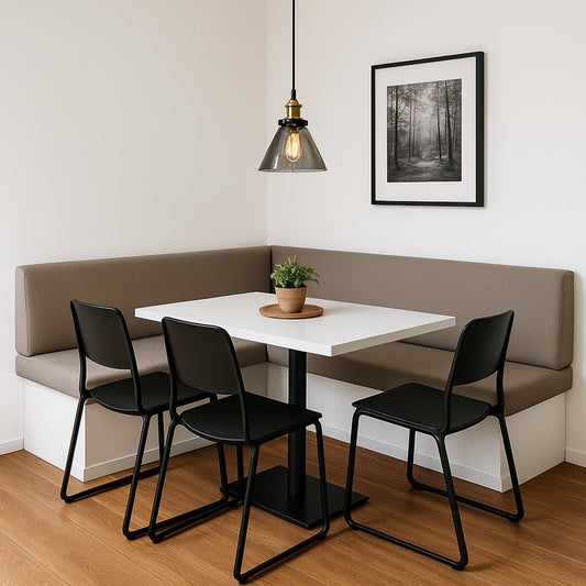 Smokey glass pendant light with brass fitting styled over dining table seating for modern home interior decor.