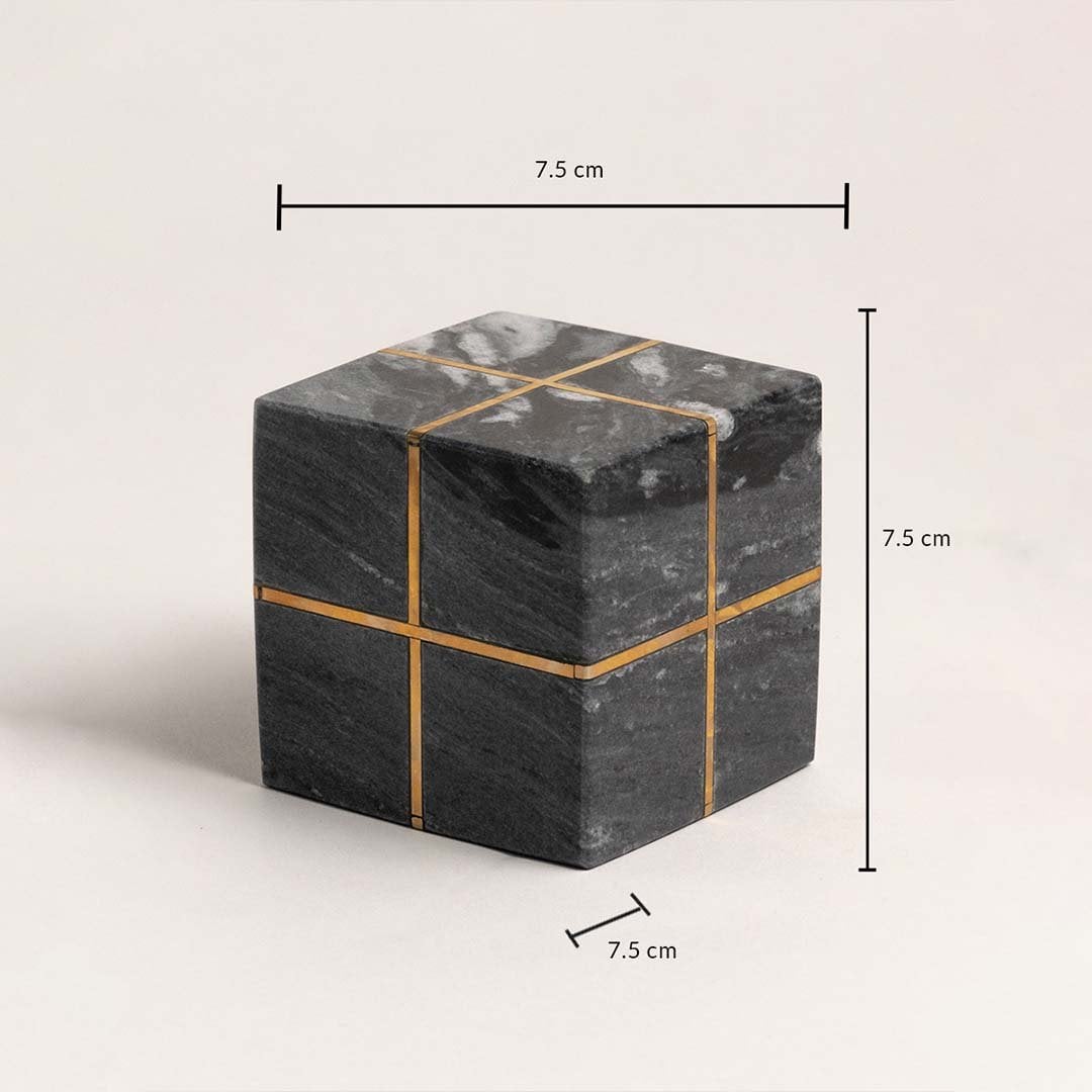 Black marble cube with gold accents showing 7.5 cm height width and depth dimensions.