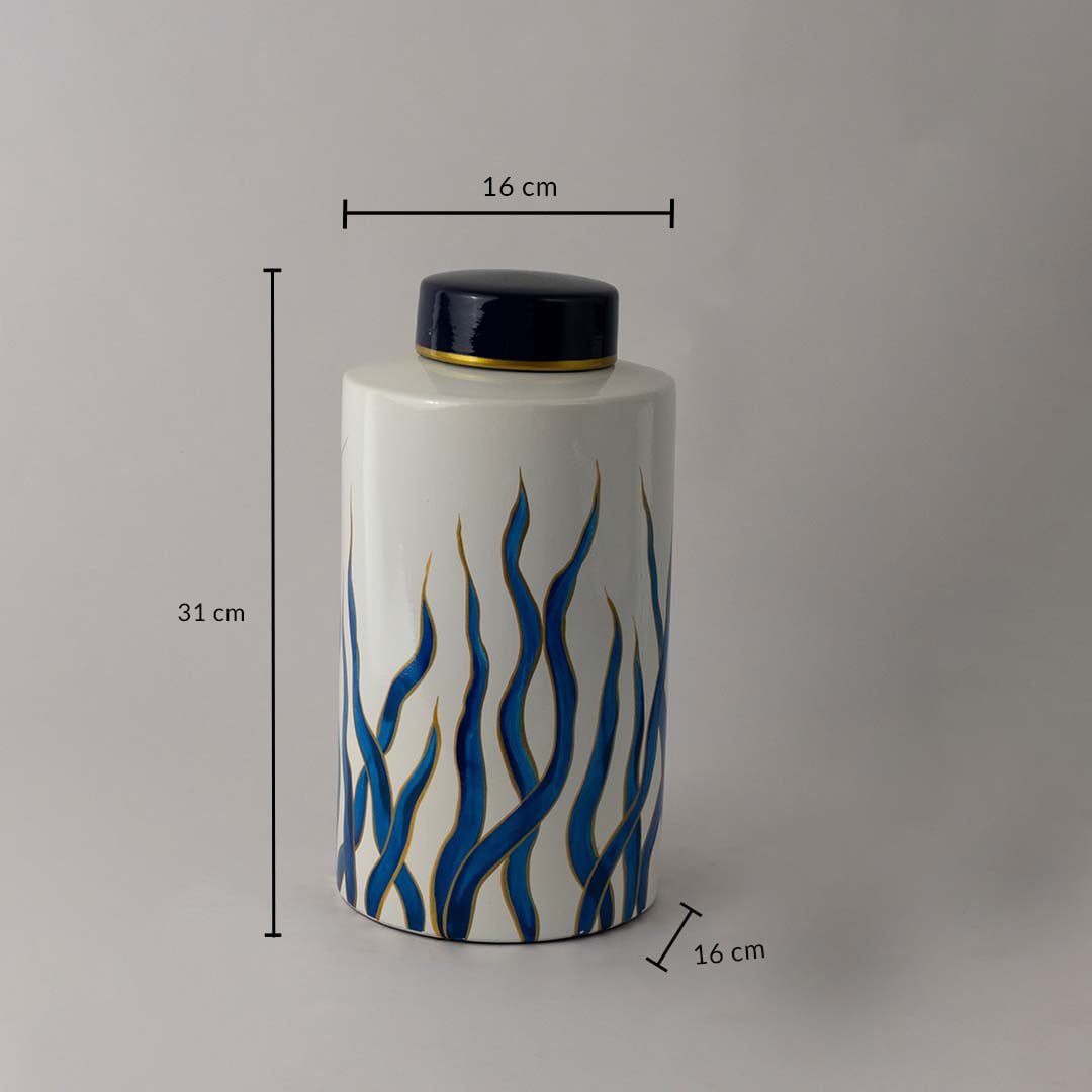 White ceramic jar with blue artistic design and gold detailing shown with 31 cm height and 16 cm width for size.
