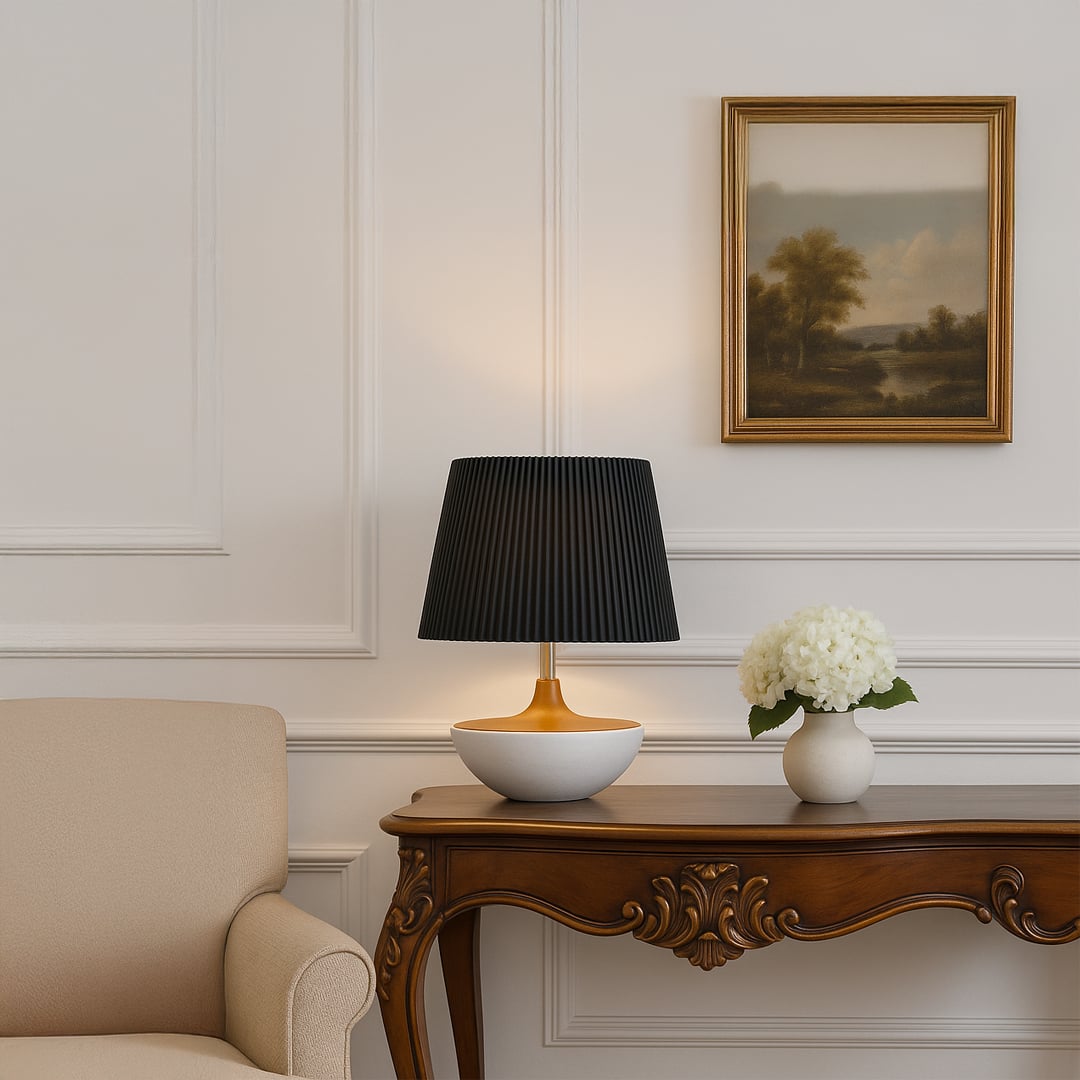 Black pleated table lamp on wooden console with classic wall paneling and floral decor for a sophisticated interior look.