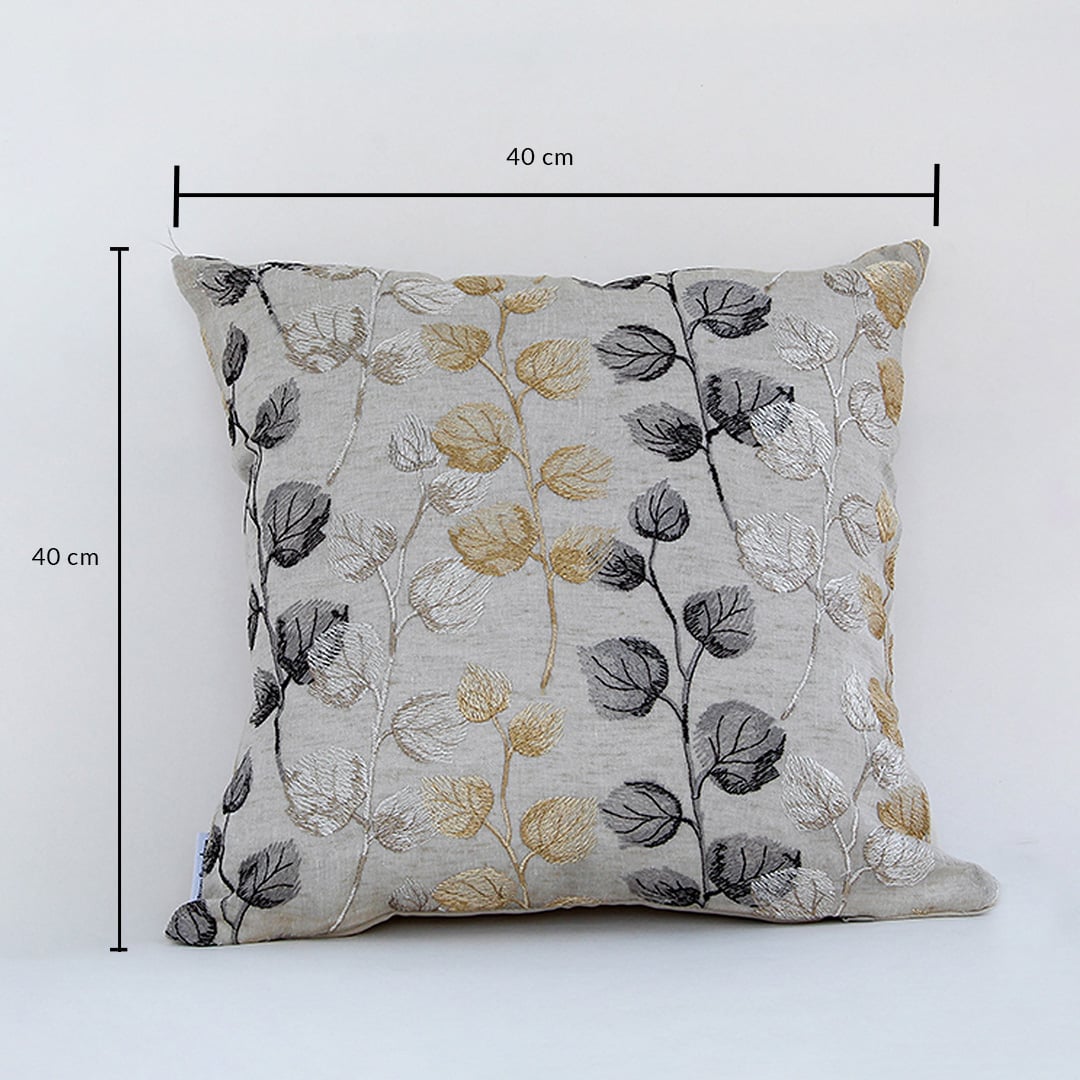 Cotton cushion with gold grey and black embroidered leaf pattern measured at 40 cm by 40 cm displayed on a white background showing its square design.