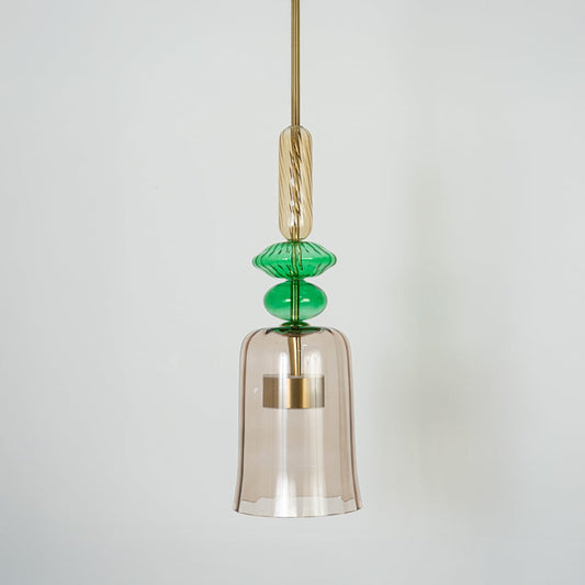 Clear glass pendant light with green accents and gold fittings crafted for contemporary home decor.