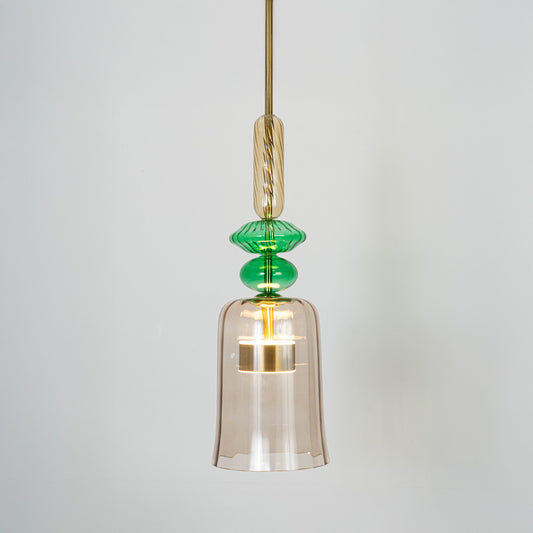 Clear glass pendant light with green accents and gold fittings crafted for modern living spaces.