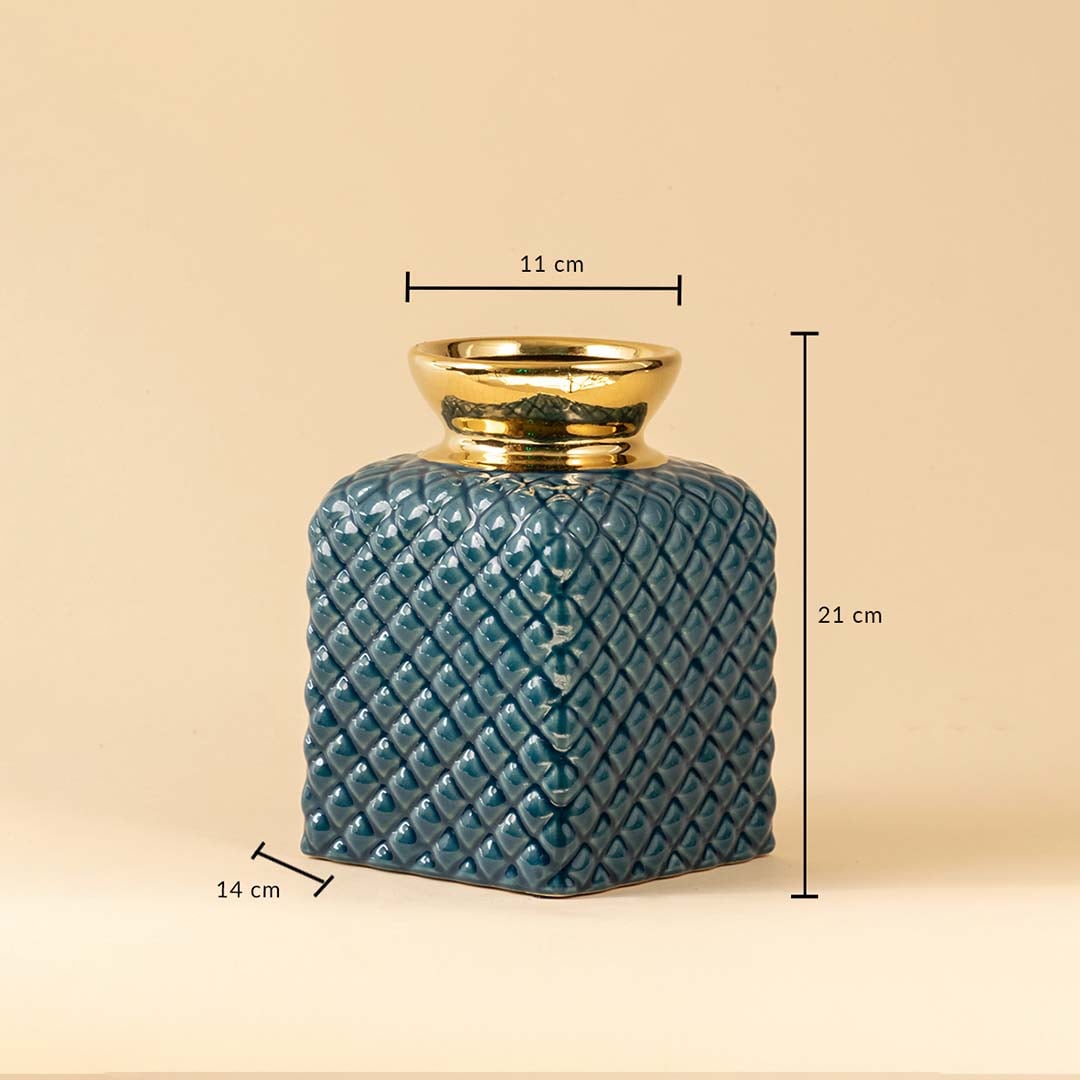A blue textured ceramic vase with gold top shown on a beige background with clear dimensions including 21 cm height 14 cm width and 11 cm top opening for accurate size reference.