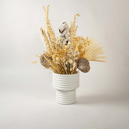 Modern white ceramic vase with ribbed texture shown on a plain white background perfect for stylish minimal interior decor.