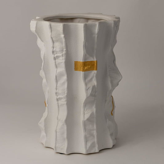 Closeup of Astra ceramic vase showing artistic folds and gold-painted textures crafted with precision for a luxurious finish.