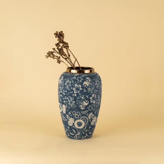 Elegant blue ceramic vase with white floral design and golden rim perfect for living room table decor.