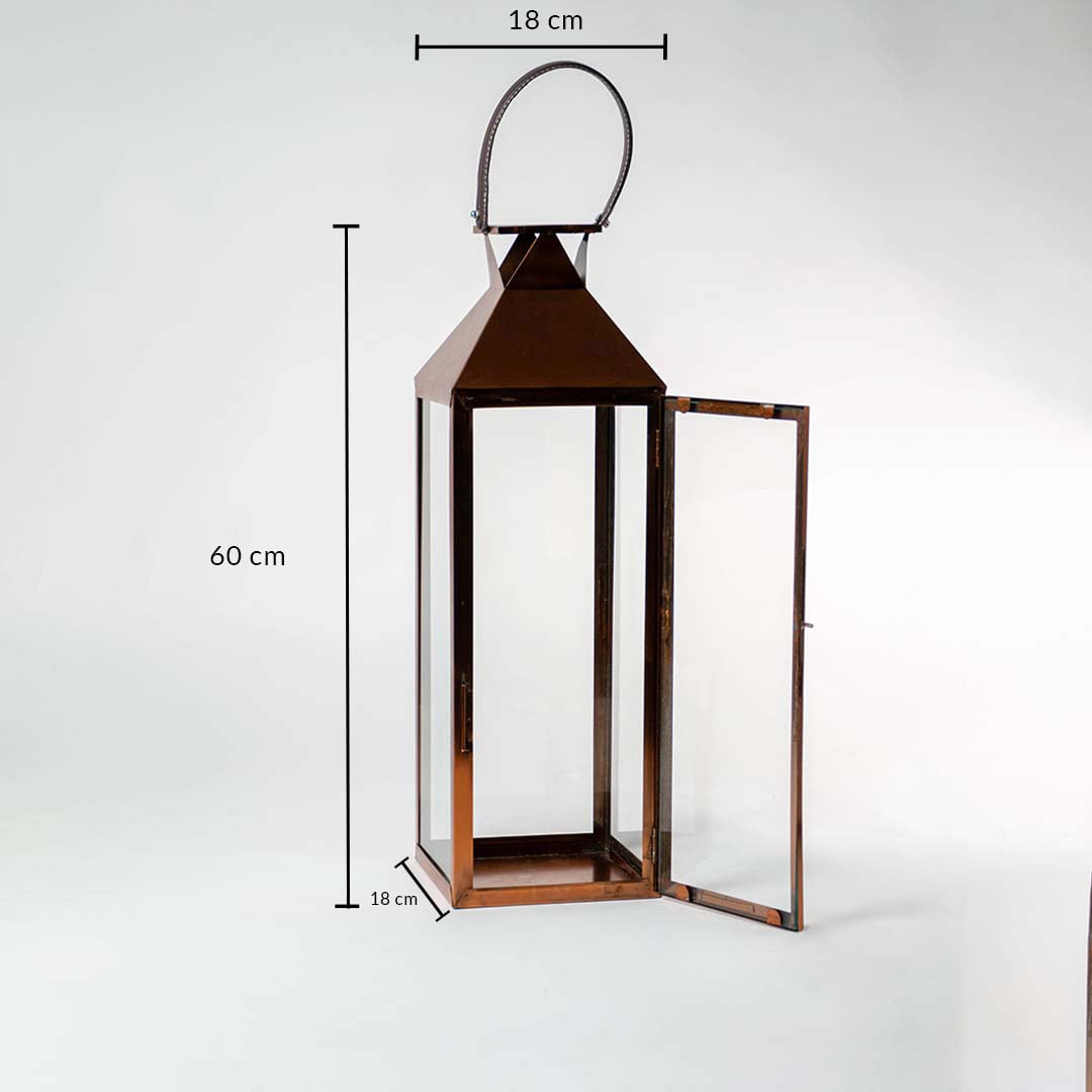 Brown metal lantern with clear glass measuring 60 cm height and 18 cm width perfect for home and garden decor accents.