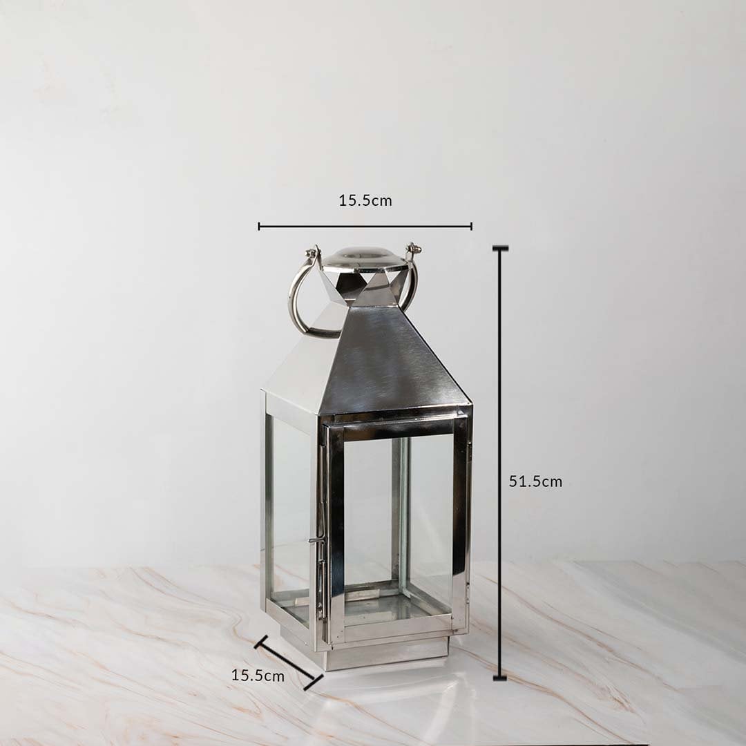 Tall silver lantern dimensions 51.5cm height and 15.5cm width with stainless steel body and glass sides.