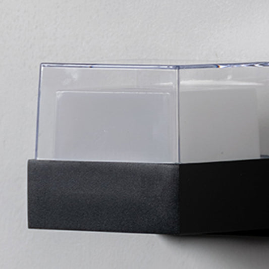 Closeup of modern wall light showing smooth matte finish and clear top diffuser offering balanced and ambient soft lighting.