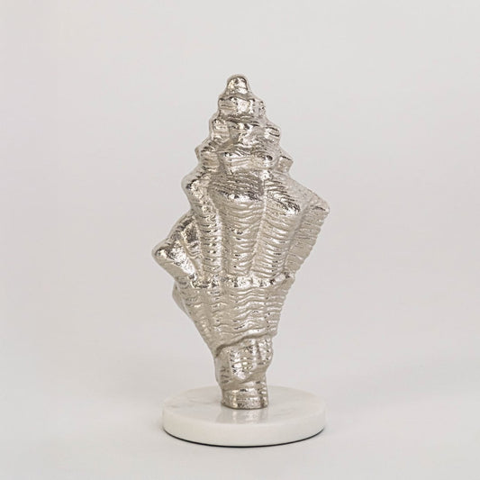 Textured silver conch shell decor on round white base clearly displayed against plain white background for showcase