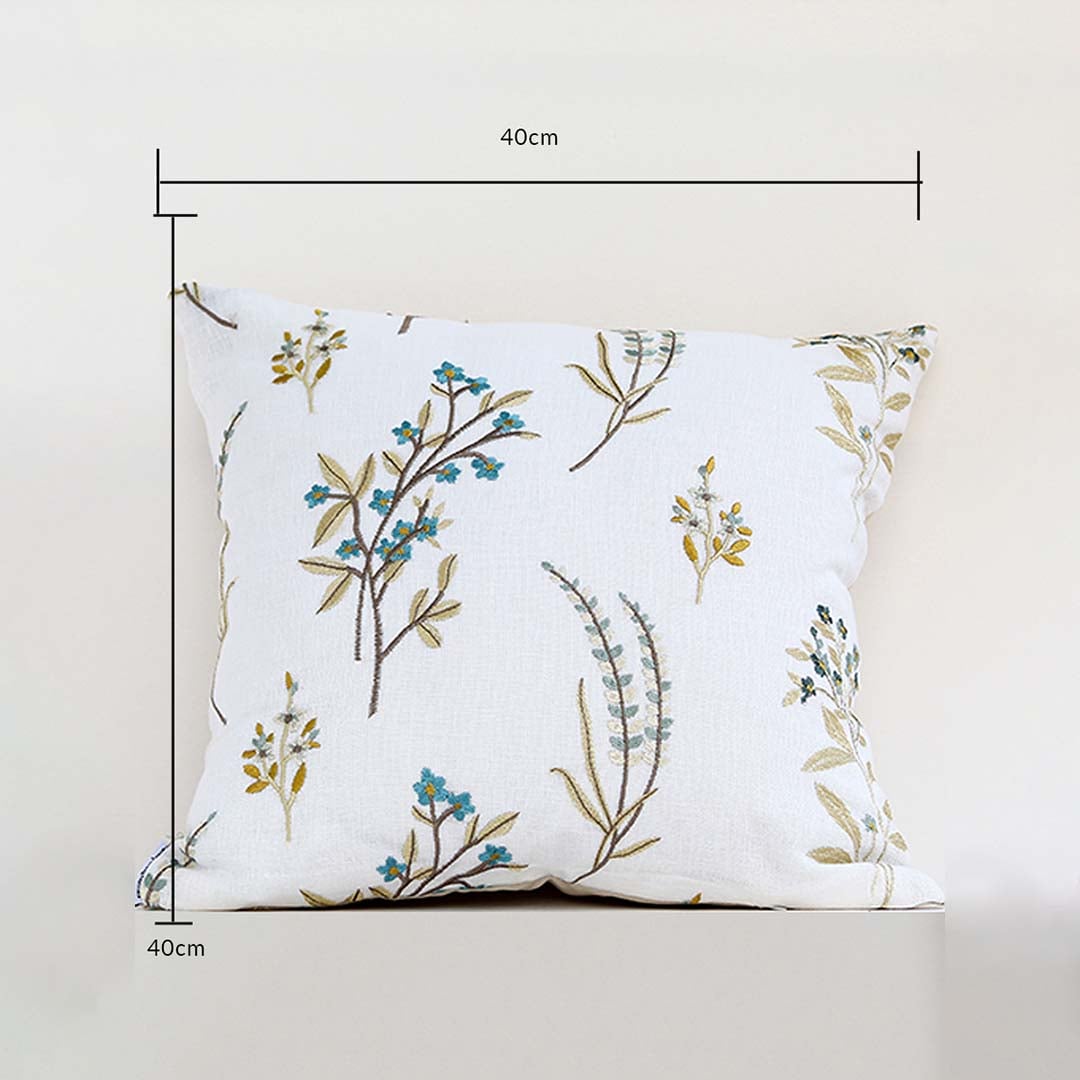 A white background dimensions image showing a floral embroidered cushion measuring 40 cm by 40 cm with botanical patterns clearly visible across the front surface.