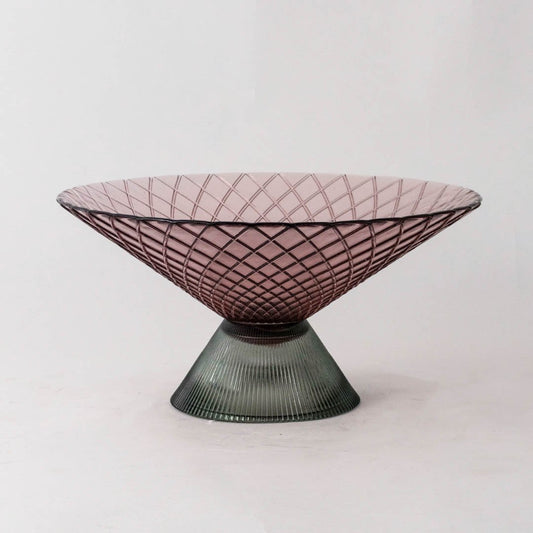 Smoky pink glass decorative bowl with green pedestal base for elegant tabletop styling and contemporary home decor.