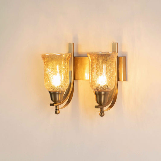 Gold metal wall light with dual glass shades on white background perfect for bedroom living room and hallway decor.