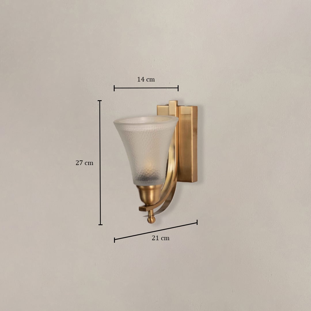 Contemporary brass wall sconce with frosted glass shade measuring 27cm height 14cm shade width and 21cm projection from wall.
