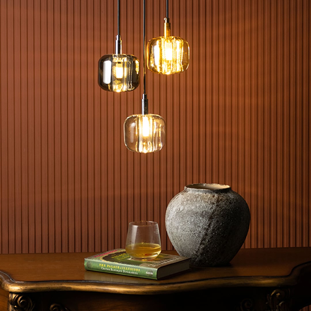 Clustered smoked glass pendant lights with black metal finish enhancing luxurious interior spaces.