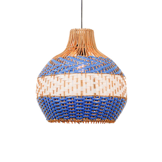 Handwoven rattan pendant light with blue and natural pattern and rounded shape hanging against soft neutral wall background for boho decor styling.
