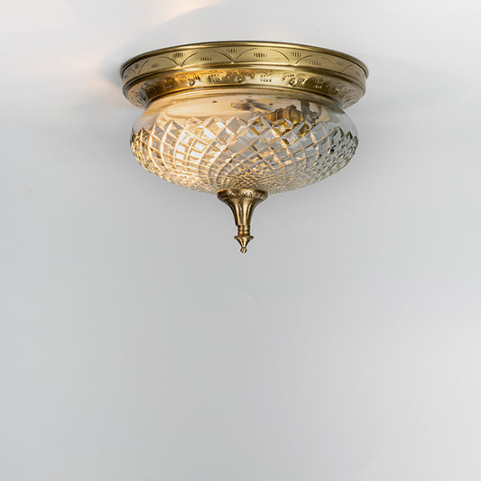 Luxury antique brass crystal ceiling light with intricate glass detailing for traditional living room decor spaces.