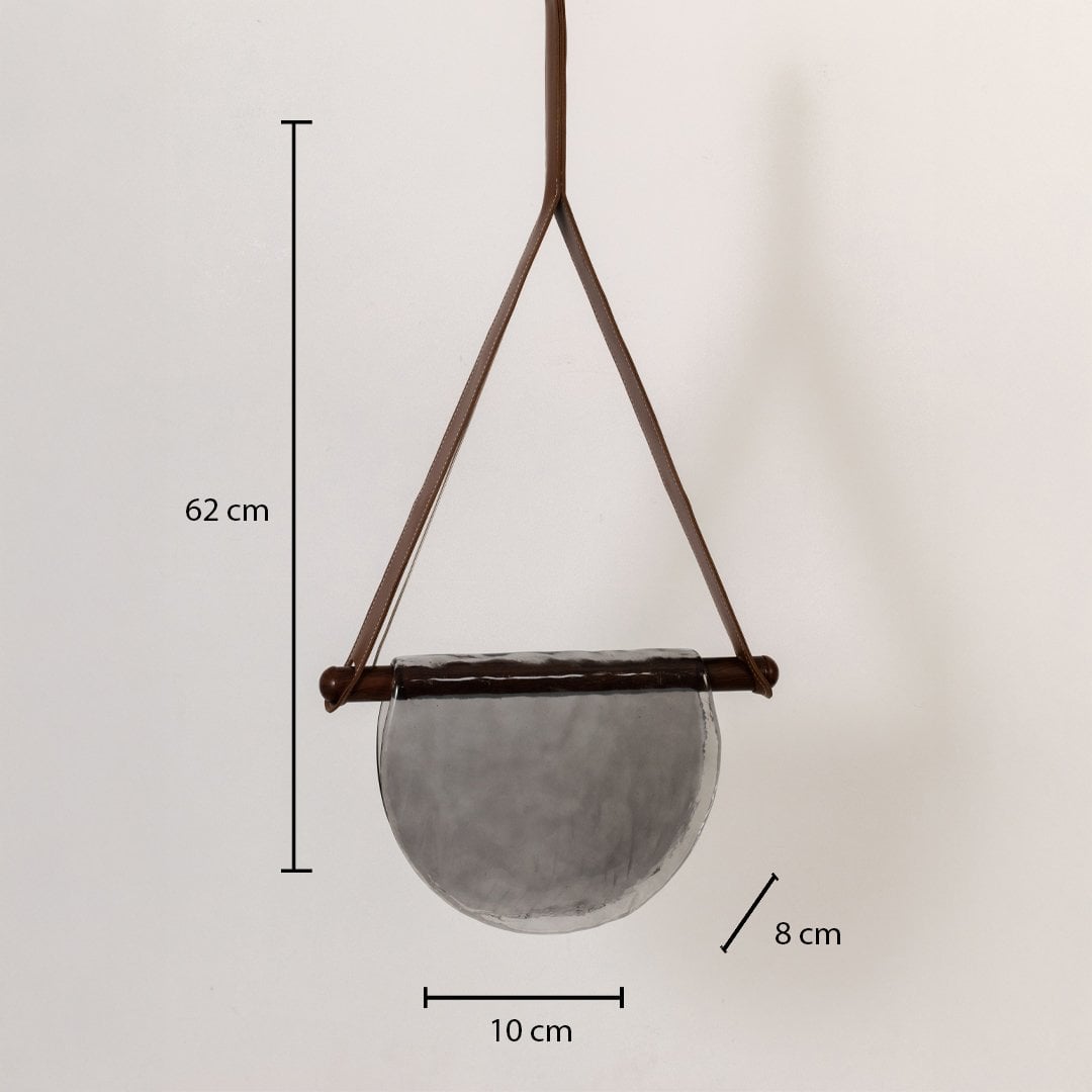 Pendant light with labeled dimensions: 62 cm height 10 cm width and 8 cm depth featuring a grey half-moon textured glass shade.