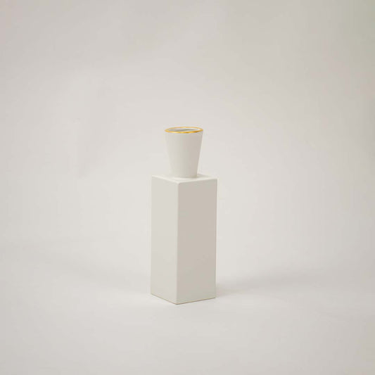 White ceramic geometric decorative vase with tall modern silhouette for tabletop styling and contemporary home decor.