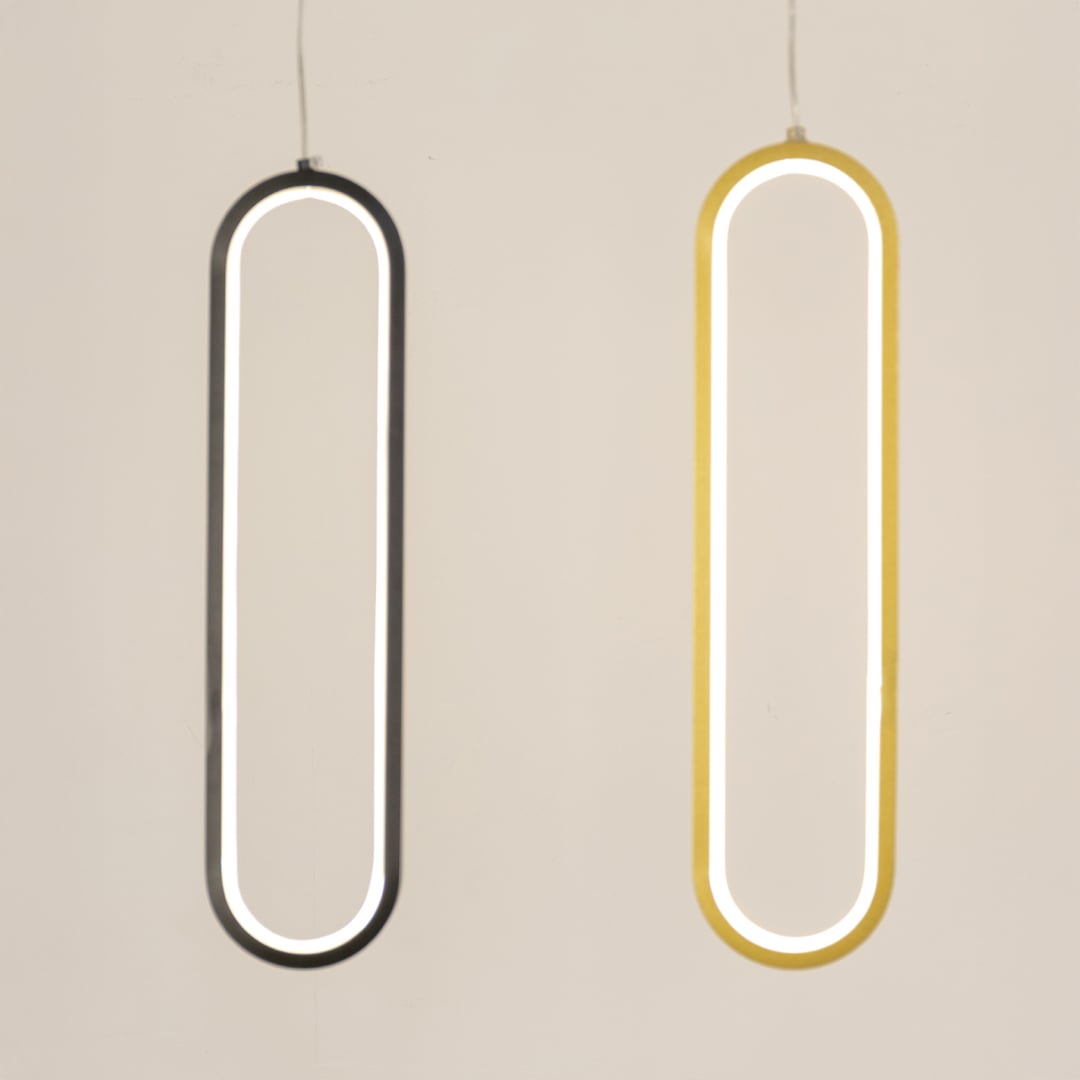 Set of modern metal elongated loop hanging lights in black and white shown together for creative wall decor styling.