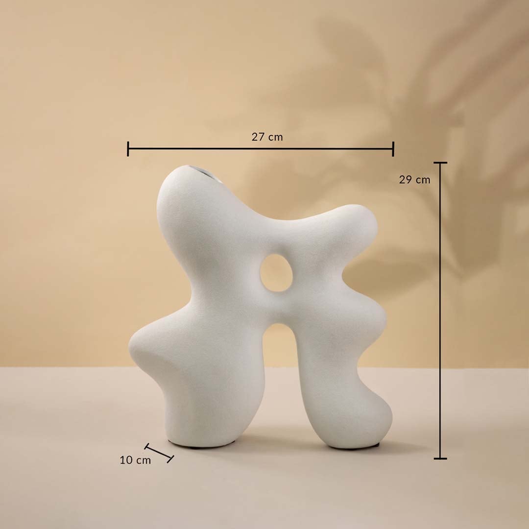 White sculptural ceramic vase measuring 29 cm in height and 27 cm in width shown with dimensions.