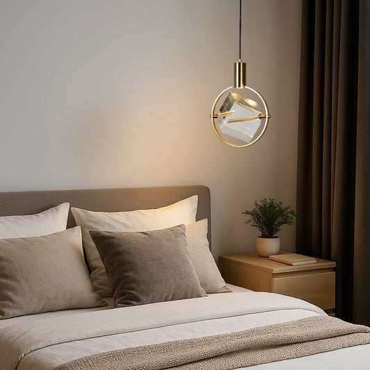 Crystal pendant light with golden frame styled in modern bedroom above bedside table for elegant home lighting.