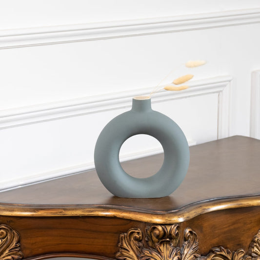 Modern green ceramic donut vase with matte finish circular hollow design perfect for pampas grass and dried flowers.