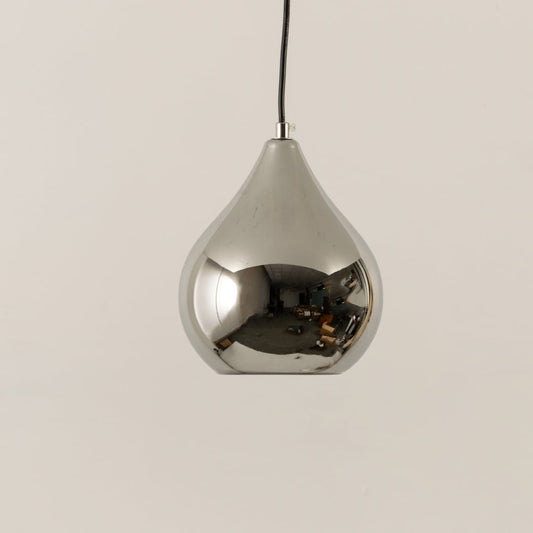 Chrome pendant light with its reflective silver body displayed with light off on a soft white background for product detailing.
