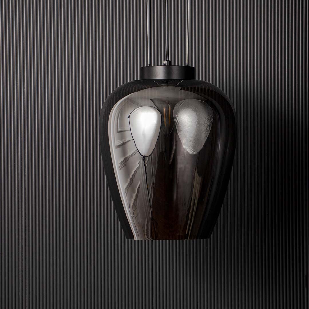 Smoked glass pendant light with sleek black suspension displayed off on black background for modern luxury interiors.