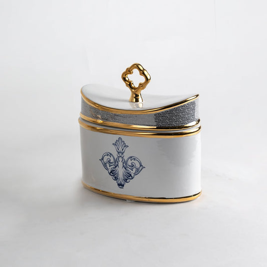 White ceramic jar with blue and gold artwork in a front view perfect for refined décor styling and elegant console placement.