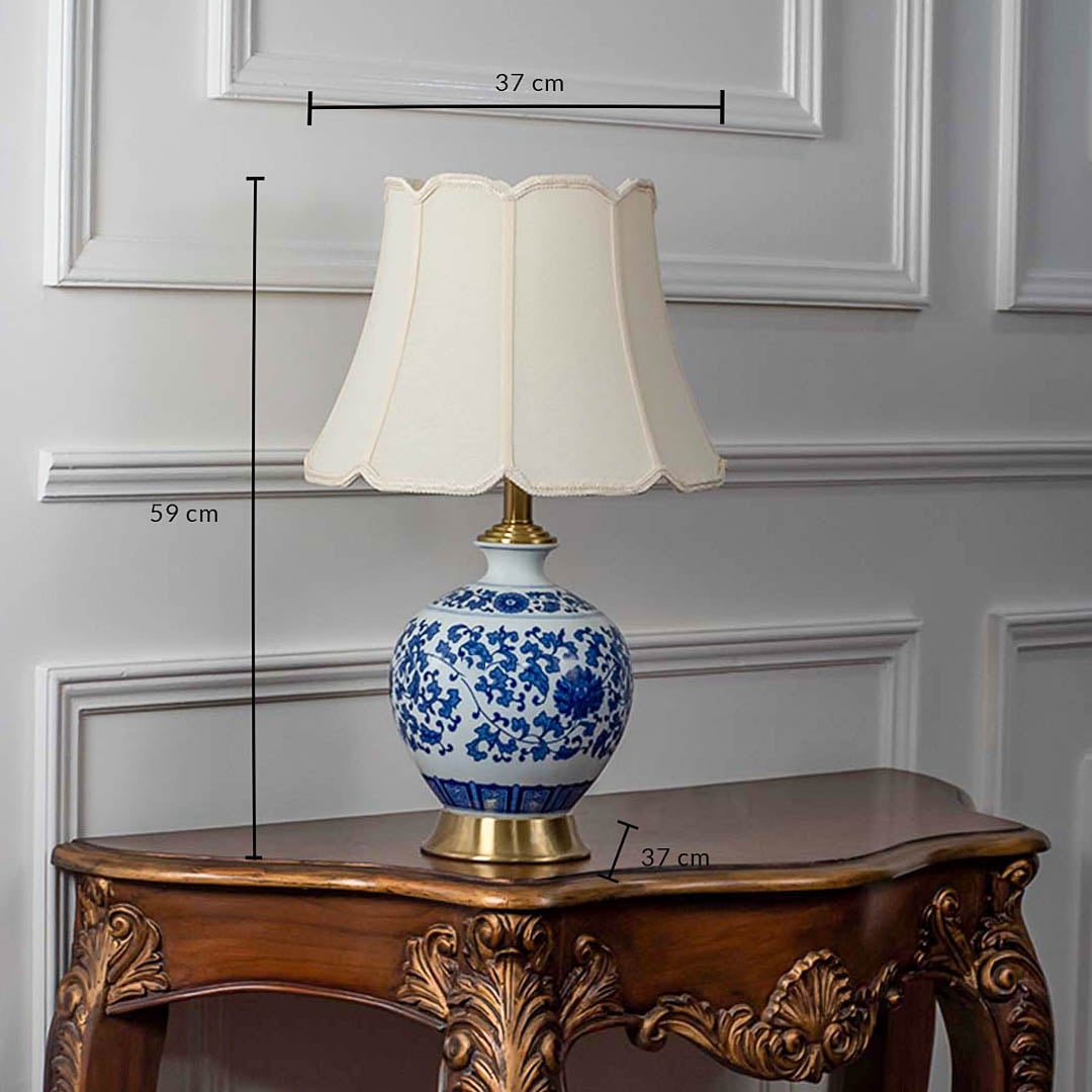 Blue and white ceramic table lamp with fabric shade measuring 49 cm height and 27 cm width for classic interiors.