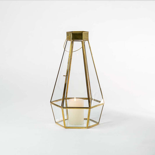 Minimal gold metal candle holder with geometric frame design for luxury tabletop decor styling.