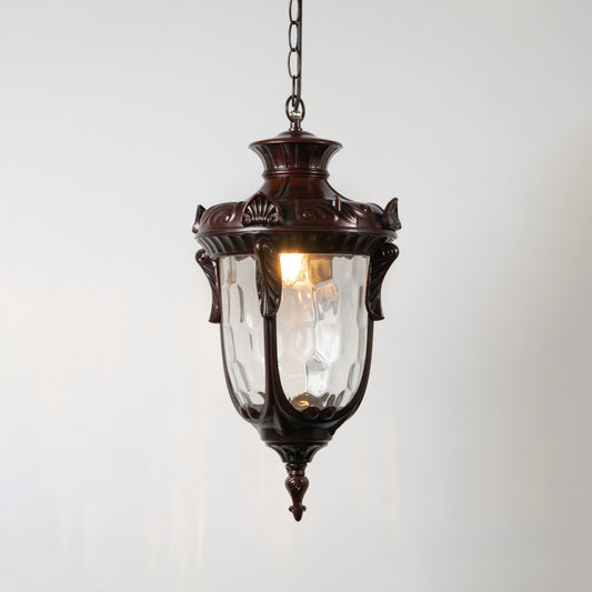 Vintage copper metal hanging lantern light with clear glass shade and warm glow for elegant outdoor decor.