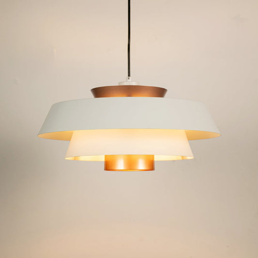 White and copper metal pendant light glowing warmly on white background creating stylish ambience for home office cafe and more spaces.