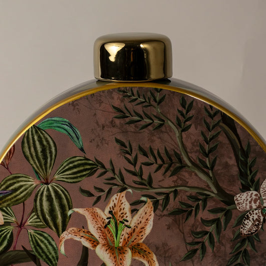 Closeup of round ceramic decorative jar with tropical floral artwork showcasing premium craftsmanship and rich detailing.