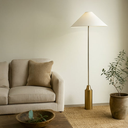 Brass and white floor lamp with slim profile and cone-shaped shade shown on white background for product showcase.