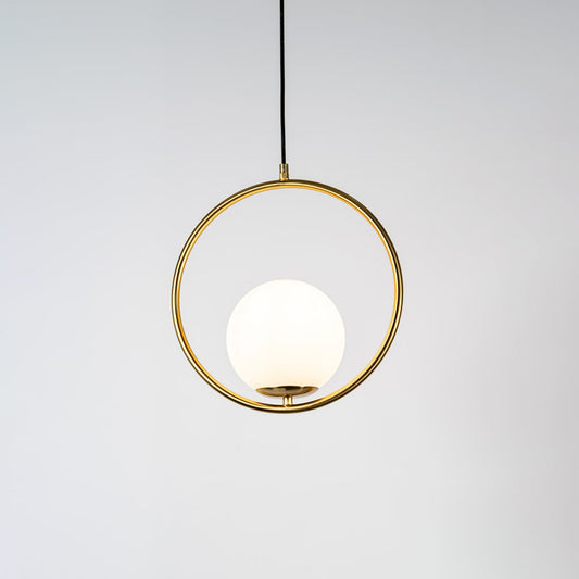 A circular pendant lamp shown with the light on against a clean white background displaying a glowing round diffuser and gold ring frame in a bright minimal style.