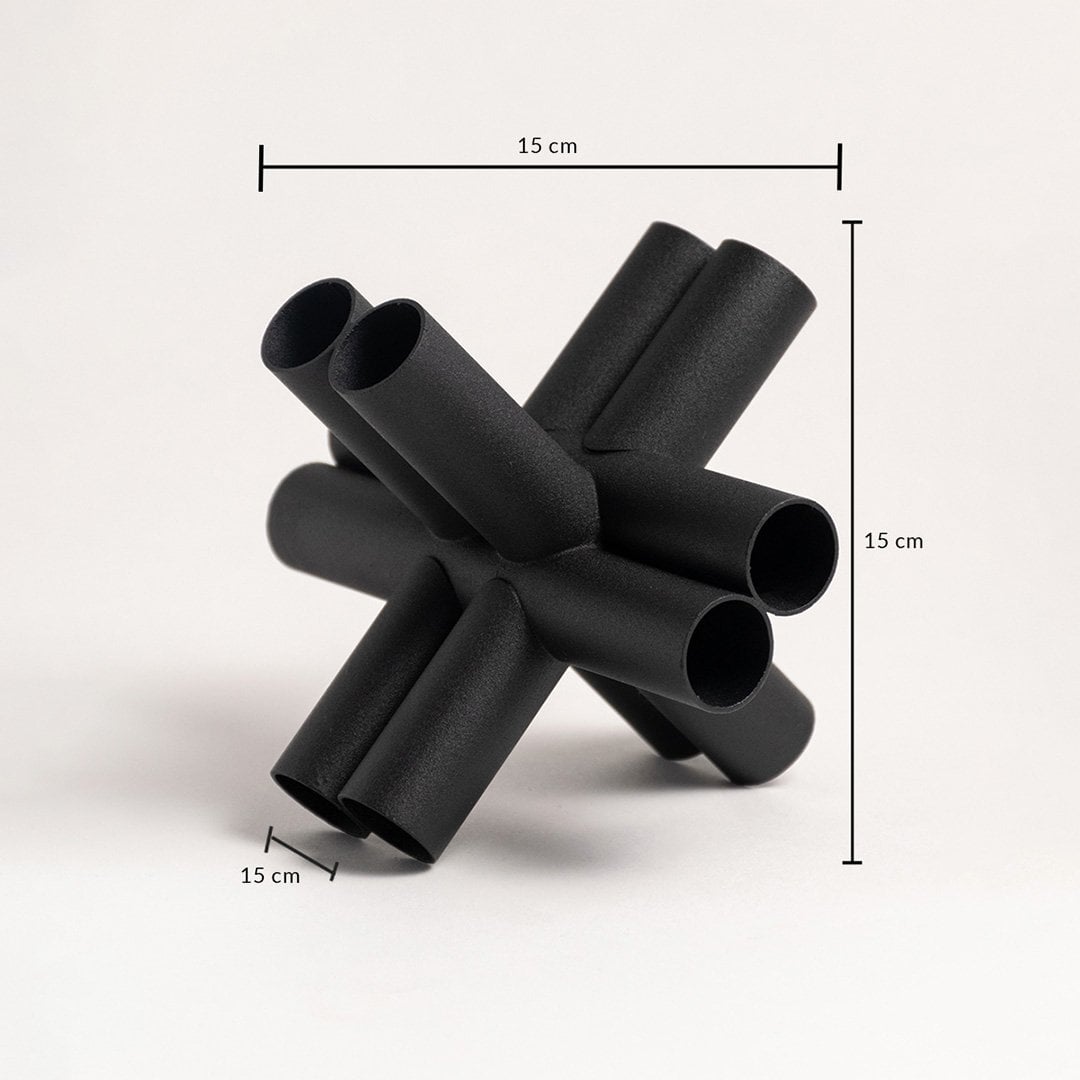 Black geometric decor sculpture shown in 15 cm height 15 cm width and 15 cm depth for accurate sizing.
