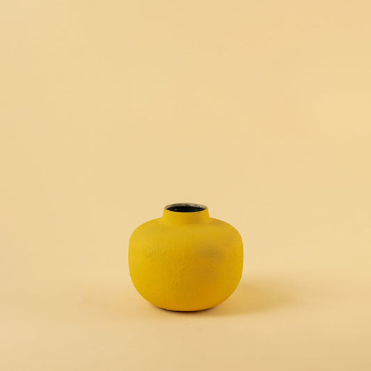 Yellow metal textured vase decor on a clean white background highlighting its bold matte finish for versatile home styling.