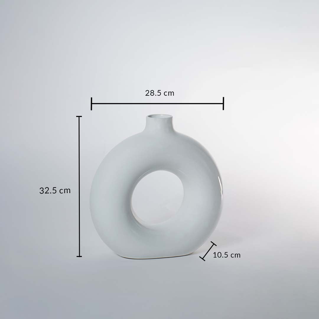 A white circular vase on a white background showing full dimensions clearly marked as 32.5 cm height 28.5 cm width and 10.5 cm depth demonstrating its exact size.